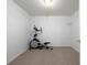 A finished basement area with an elliptical exercise machine at 5 Glenn Eagles Vw, Hiram, GA 30141