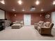 Finished basement with a projector and couches at 5 Glenn Eagles Vw, Hiram, GA 30141