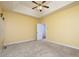 Bright bedroom features a ceiling fan, neutral carpet, and easy access to the bath and closet at 5 Glenn Eagles Vw, Hiram, GA 30141