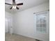 Carpeted bedroom featuring a ceiling fan, window, and closet at 5 Glenn Eagles Vw, Hiram, GA 30141