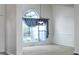 Open dining area featuring large windows with valances and a chandelier for a warm ambiance at 5 Glenn Eagles Vw, Hiram, GA 30141