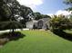 Beautiful home boasts a lush green lawn and mature landscaping, creating a serene curb appeal at 5 Glenn Eagles Vw, Hiram, GA 30141