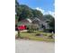 Charming single-story home featuring stone accents and a well-manicured front yard at 5 Glenn Eagles Vw, Hiram, GA 30141