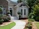 Inviting entrance showcases a stone-accented facade and a walkway surrounded by manicured greenery at 5 Glenn Eagles Vw, Hiram, GA 30141