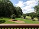 Lush golf course view from the back deck with mature trees and well-manicured landscaping at 5 Glenn Eagles Vw, Hiram, GA 30141