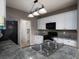 Galley kitchen featuring white cabinets, granite countertops, and stainless steel appliances at 5 Glenn Eagles Vw, Hiram, GA 30141