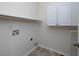 Laundry room with tile flooring, storage shelves, and hookups at 5 Glenn Eagles Vw, Hiram, GA 30141