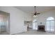 Open-concept living room with a stone fireplace and a view into the dining area at 5 Glenn Eagles Vw, Hiram, GA 30141