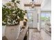 A bright entryway with wood floors, a console table with lamps, and decorative mirrors at 5330 Keepsake Court, Cumming, GA 30040