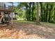 Wooded lot with trees and grassy backyard. Exterior of deck structure visible at 6192 Holiday Blvd, Forest Park, GA 30297