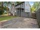 Home features a basketball court and patio with two tiers of decking leading to backyard at 6192 Holiday Blvd, Forest Park, GA 30297