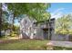 Home features a two-tiered deck, basketball hoop and grassy backyard area at 6192 Holiday Blvd, Forest Park, GA 30297