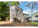 Exterior shot of the house showing two tiers of decking and steps down to backyard at 6192 Holiday Blvd, Forest Park, GA 30297
