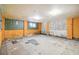 Unfinished basement with concrete walls and floor, and a small window at 6192 Holiday Blvd, Forest Park, GA 30297