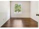 Empty bedroom showcasing hardwood floors, neutral paint and natural light at 6192 Holiday Blvd, Forest Park, GA 30297