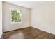Bright bedroom with hardwood floors, neutral paint and a window at 6192 Holiday Blvd, Forest Park, GA 30297