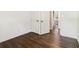 Neutral bedroom featuring hardwood flooring, closet space and access to bathroom at 6192 Holiday Blvd, Forest Park, GA 30297