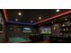 Entertainment room with a pool table, bar, and multiple televisions at 6192 Holiday Blvd, Forest Park, GA 30297