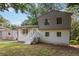 Beautiful house showing off it's unique architecture, large windows, and updated paint scheme at 6192 Holiday Blvd, Forest Park, GA 30297