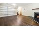 Spacious living room with fireplace, built in shelving and hardwood flooring at 6192 Holiday Blvd, Forest Park, GA 30297