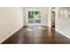 Bright Living Room features hardwood floors, a sliding glass door, and an abundance of natural light at 6192 Holiday Blvd, Forest Park, GA 30297