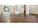 Open concept living space with beautiful hardwood floors, neutral paint and a sliding glass door to outside at 6192 Holiday Blvd, Forest Park, GA 30297