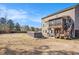 Expansive backyard featuring a hot tub, screened-in porch, and plenty of space for outdoor activities at 157 Donovan Ave, Locust Grove, GA 30248