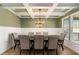 Elegant dining room with coffered ceilings, modern chandelier, and wainscoting at 157 Donovan Ave, Locust Grove, GA 30248