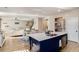Open concept view of kitchen with island connecting to dining area and living room at 157 Donovan Ave, Locust Grove, GA 30248