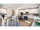 Spacious open-concept kitchen featuring a large island, modern appliances, and hardwood floors at 157 Donovan Ave, Locust Grove, GA 30248