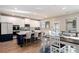 Open-concept kitchen features a large island with seating, modern appliances, and hardwood floors at 157 Donovan Ave, Locust Grove, GA 30248