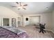 Spacious main bedroom with a seating area and vaulted ceilings with natural light at 157 Donovan Ave, Locust Grove, GA 30248