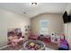 Bright playroom with colorful toys, a ball pit, and plenty of space for fun and activities at 157 Donovan Ave, Locust Grove, GA 30248