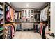 Walk-in closet with custom shelving, clothing racks and hardwood floors at 157 Donovan Ave, Locust Grove, GA 30248