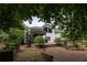 Tranquil backyard featuring a deck, garden beds, and lush greenery, creating a private retreat at 3548 Liberty Ln, Marietta, GA 30062