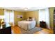 Cozy bedroom with hardwood floors, shuttered windows, and a comfortable bed with decorative pillows at 3548 Liberty Ln, Marietta, GA 30062