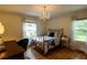 Bright bedroom with hardwood floors, chandelier, and windows with natural light at 3548 Liberty Ln, Marietta, GA 30062