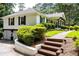 Charming home with a beautiful brick pathway and lush landscaping, adding to its appeal at 3548 Liberty Ln, Marietta, GA 30062