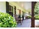 Inviting front porch with seating, providing a cozy outdoor space and charming details at 3548 Liberty Ln, Marietta, GA 30062