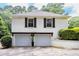 Two-car garage with a clean exterior, offering ample parking and storage space at 3548 Liberty Ln, Marietta, GA 30062