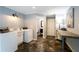 Open hallway featuring laundry area, view to bathroom and decorative table with modern accents at 3548 Liberty Ln, Marietta, GA 30062