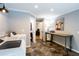 Hallway featuring laundry area and decorative table with modern accents and open doorways at 3548 Liberty Ln, Marietta, GA 30062
