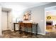 Hallway with a decorative table, art, and access to other rooms in the house at 3548 Liberty Ln, Marietta, GA 30062