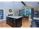 Kitchen with island, stainless appliances, granite countertops, and adjoining dining area at 3548 Liberty Ln, Marietta, GA 30062