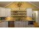 Kitchen with stainless steel appliances, granite countertops, and decorative display shelves at 3548 Liberty Ln, Marietta, GA 30062