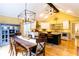 Eat-in kitchen featuring island, stainless appliances, granite countertops, adjoined with dining room at 3548 Liberty Ln, Marietta, GA 30062