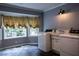 Spacious laundry room with a large window and modern washer and dryer at 3548 Liberty Ln, Marietta, GA 30062