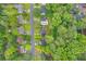 Overhead view shows the home highlighted on a tree-lined 0.18-acre lot at 6338 Boyett Dr, Norcross, GA 30093