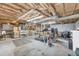 Versatile basement with a treadmill, workout equipment, and ample space for recreation and fitness at 6338 Boyett Dr, Norcross, GA 30093