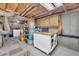 Unfinished basement area with exposed beams, utility connections, and storage opportunities at 6338 Boyett Dr, Norcross, GA 30093